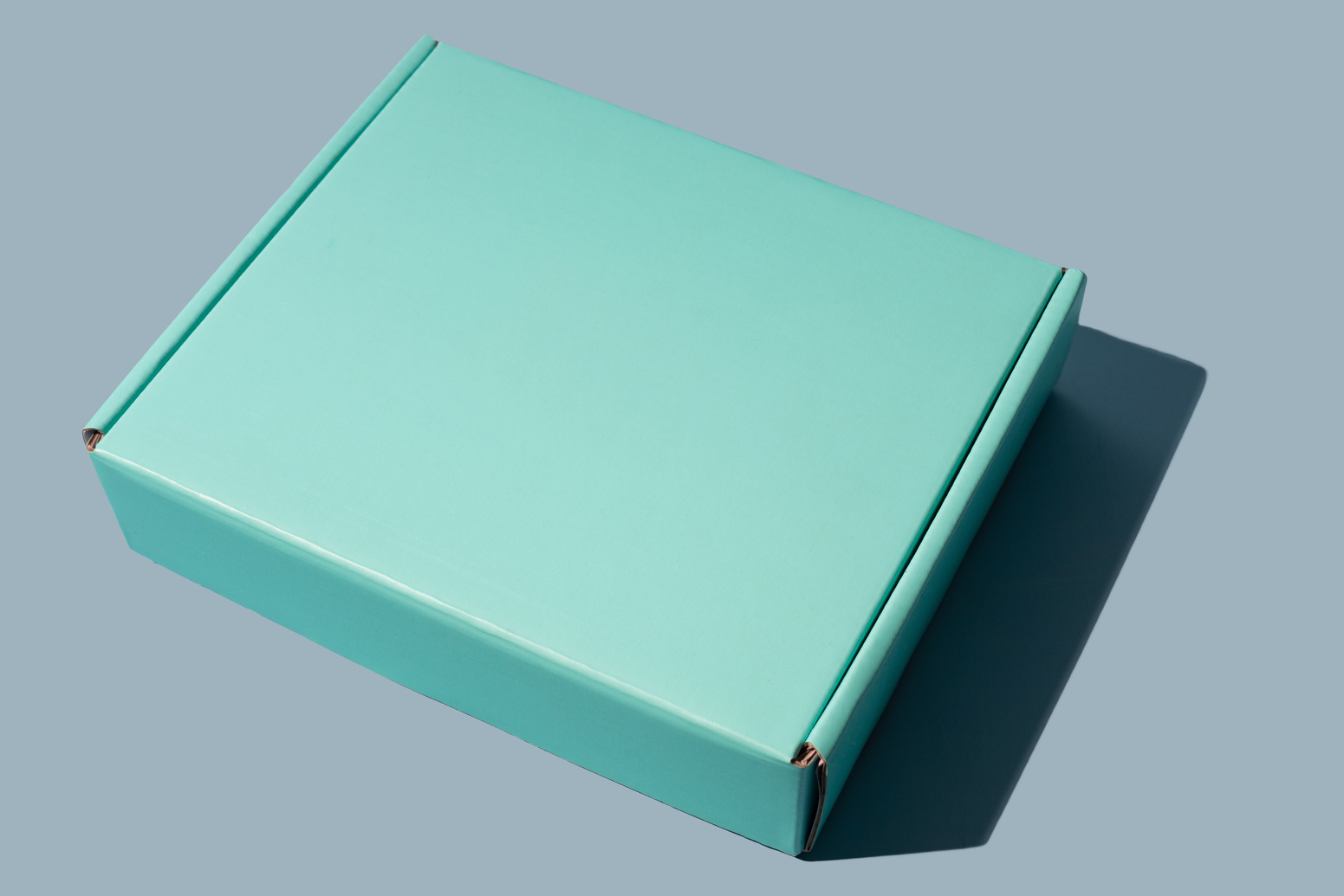 Turquoise Cardboard Box on a Table